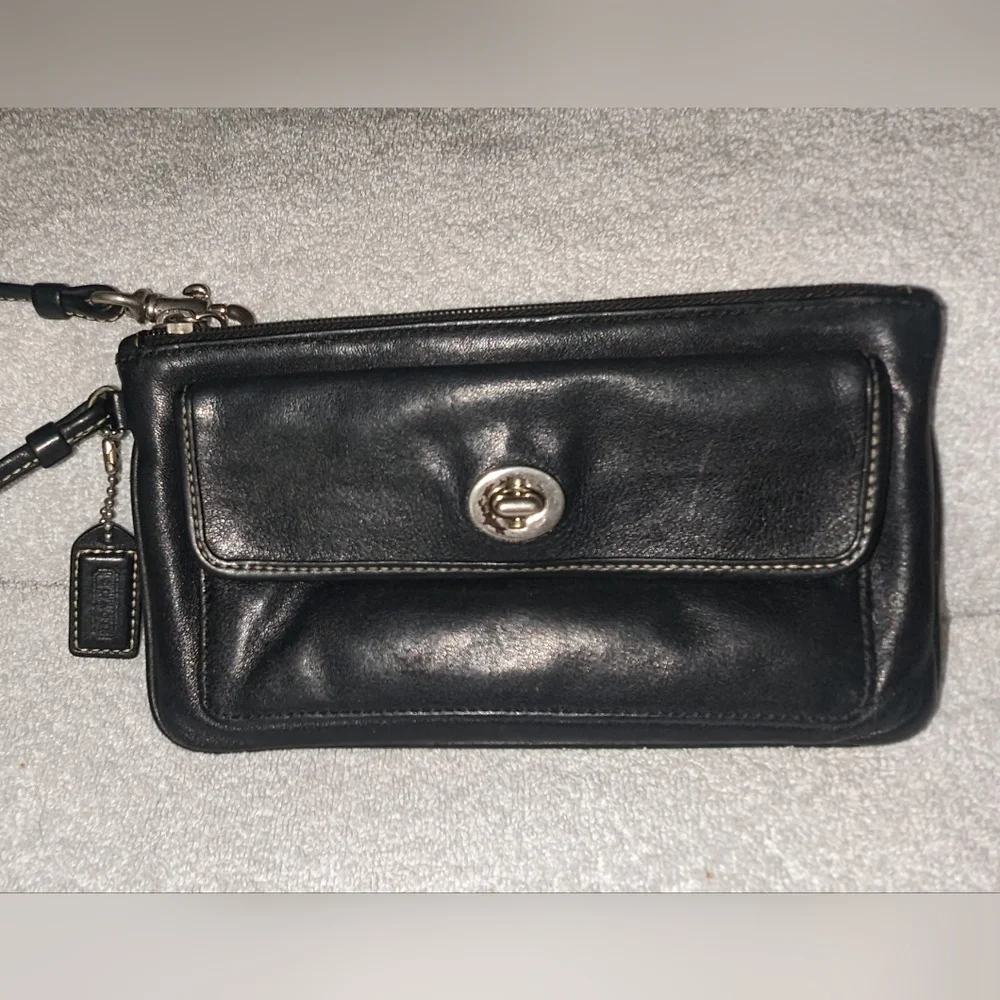 Coach black leather turn lock flap wristlet.